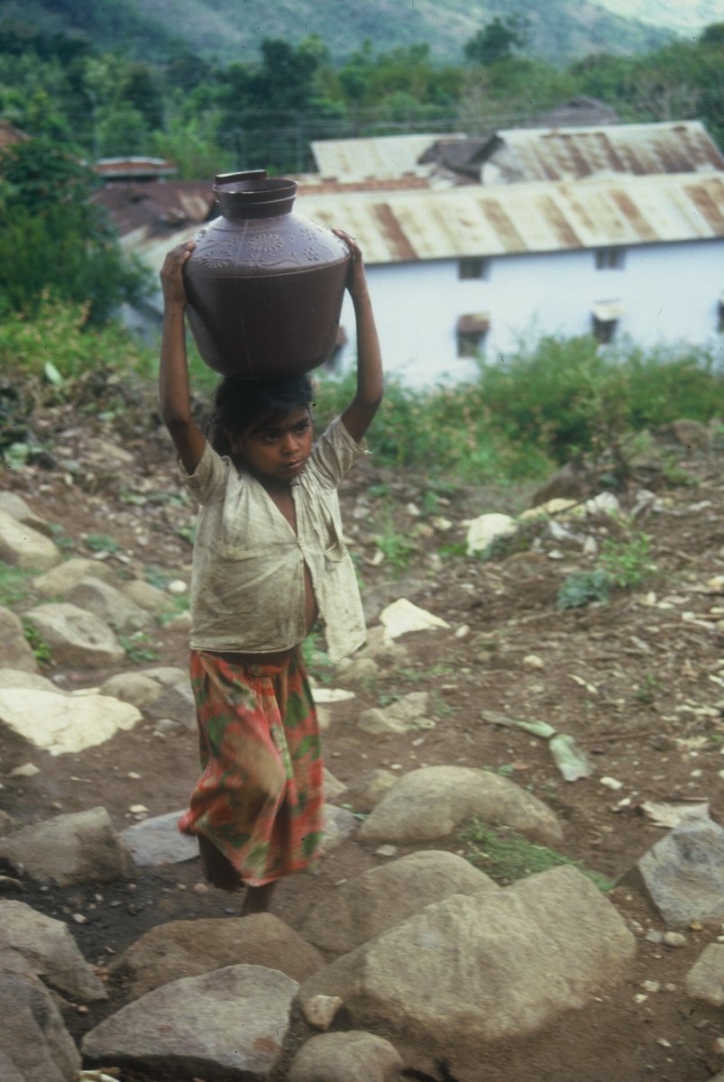 Girl-carrying-water